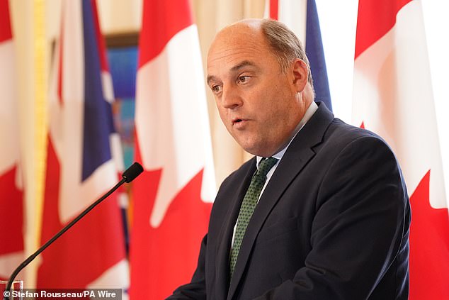 Sir Ben Wallace (pictured) said if Trump capitulated to the Kremlin it would be a repeat of Chamberlain's 'peace in our time' moment in Munich in 1938.