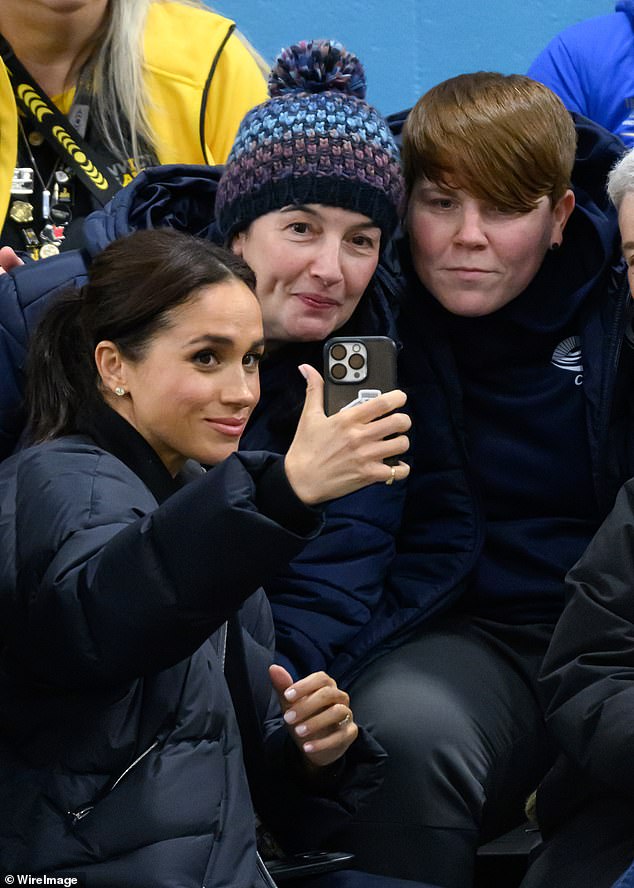 Meghan Markle poses for a snap with attendees at the Invictus Games wheelchair curling event in Vancouver this week