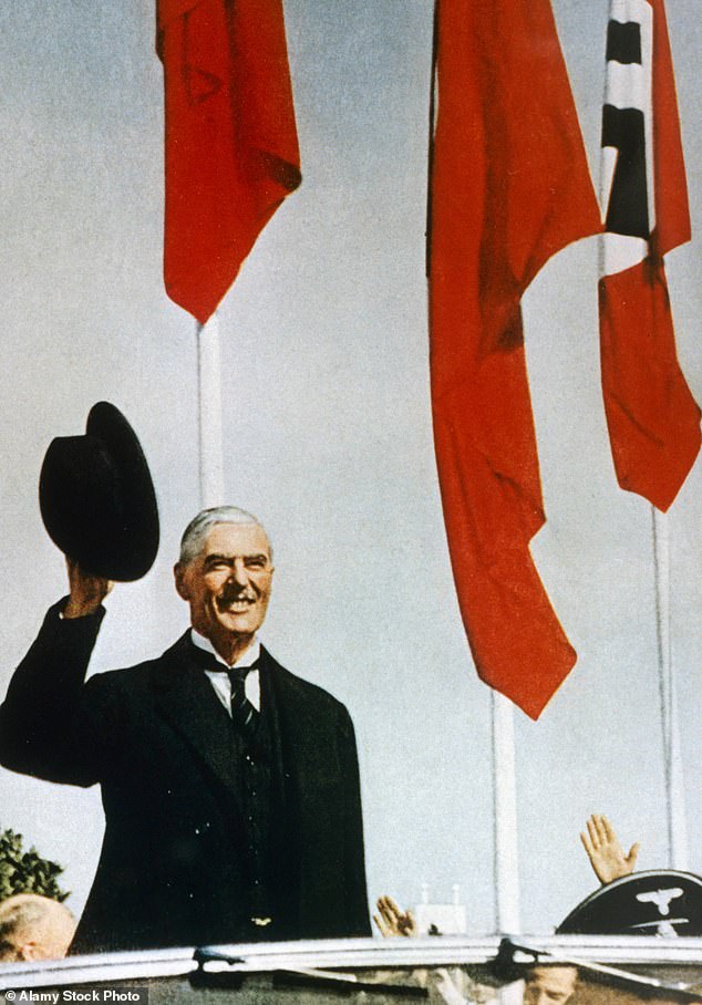 Neville Chamberlain waves from an open-top car, shortly after arriving in Munich for a meeting with Adolf Hitler in 1938. His betrayal of Czechoslovakia is always dragged out of its glass case at such moments, writes Peter Hitchens