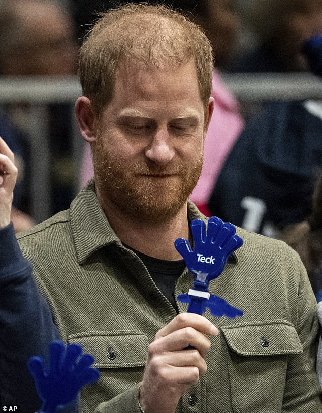 The Duke of Sussex looks at a noise maker during Sitting Volleyball semifinals between Nigeria and Britain