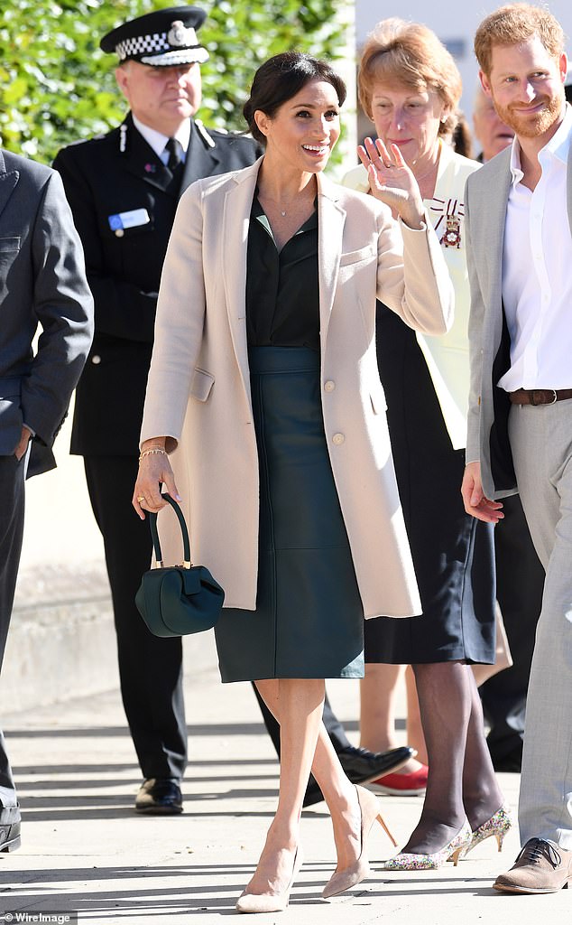 Visiting Sussex for the first time as the Duchess of Sussex, Meghan donned a cashmere coat by Emporio Armani