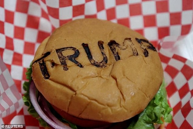 When King Charles next visits Washington will the hamburger-chomping President offer him his first Big Mac? Pictured: A Trump-branded burger at Trump-themed restaurant Trump Burger in Texas
