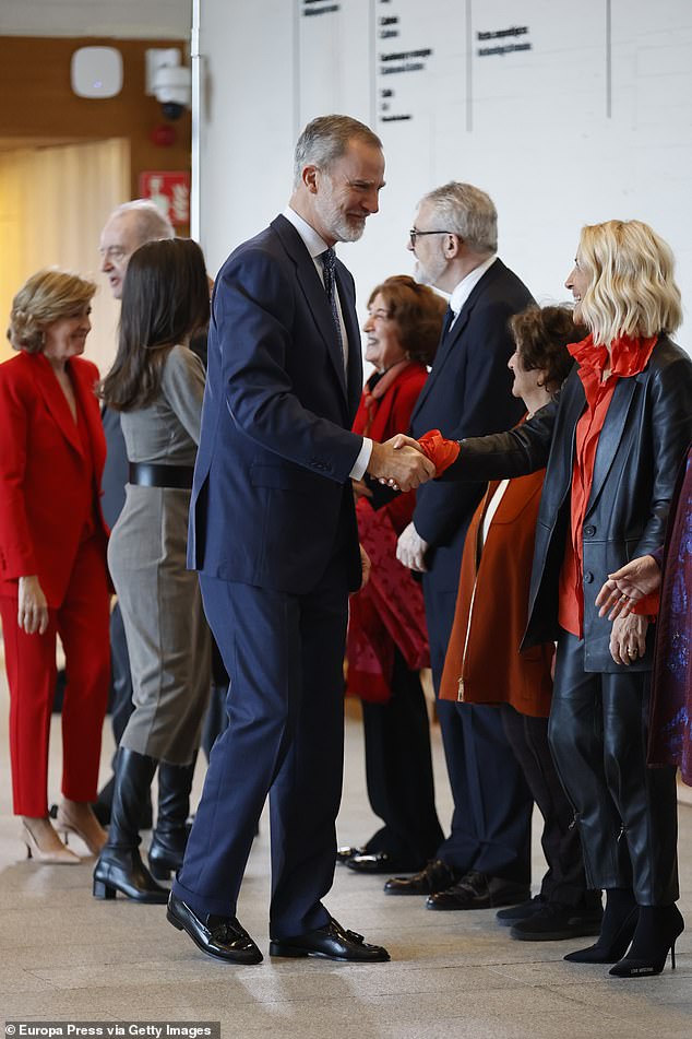 Felipe appeared composed as he was pictured alongside to his dazzling wife in Madrid today
