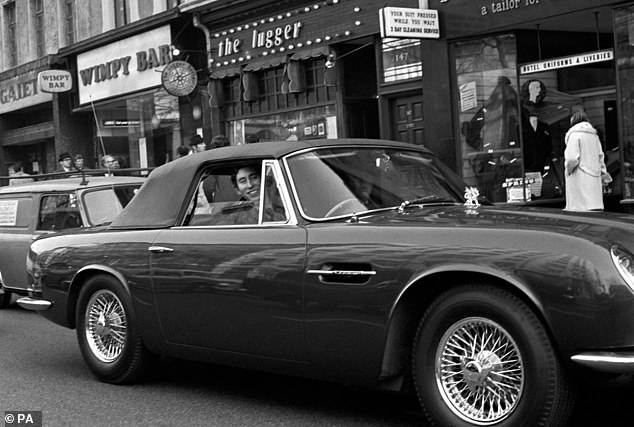 King Charles in his Aston Martin DB6 in 1971