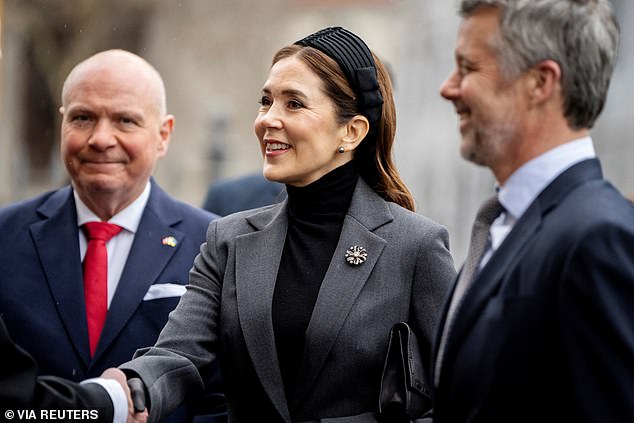 Mary wore her chestnut-coloured hair swept back with a wide headband and added a pair of grey pearl earrings