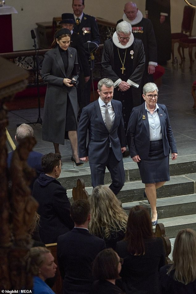King Frederik, 56, wore a navy suit along with a white shirt and patterned tie