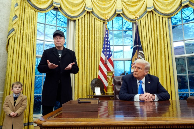 Elon Musk, his child and Donald Trump together in the Oval Office.