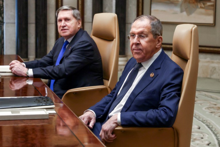 Russian Foreign Minister Sergei Lavrov, right, sits next to Russian President Vladimir Putin's foreign policy advisor Yuri Ushakov during a meeting with U.S. Secretary of State Marco Rubio, U.S. National Security Advisor Mike Waltz and U.S. Middle East envoy Steve Witkoff, Saudi Foreign Minister Prince Faisal bin Farhan Al Saud and Saudi National Security Advisor Mosaad bin Mohammad Al-Aiban, at Diriyah Palace, in Riyadh, Saudi Arabia, Tuesday, Feb. 18, 2025. (Evelyn Hockstein/Pool Photo via AP)