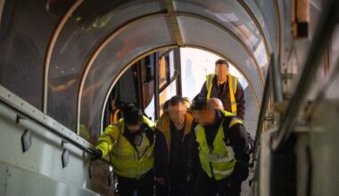 Backlash after pictures emerge of migrants being forced onto flights as deportations rise rapidly