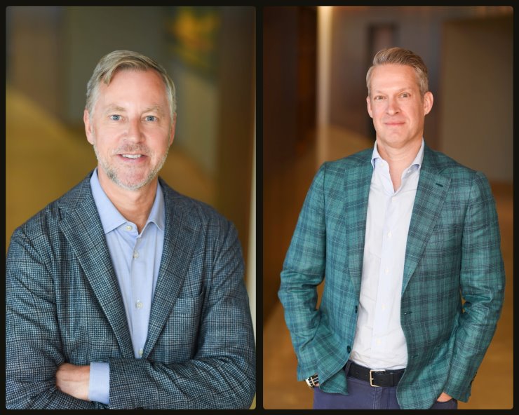 A composite shot of ArcLight Founder Dan Revers and Partner Lucius Taylor, both smiling and wearing stylish blue suits