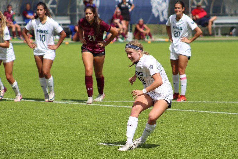 Colorado School of Mines forward Reese McDermott, center, takes a penalty kick during the Sept. 15 home game against West Texas A&M.
