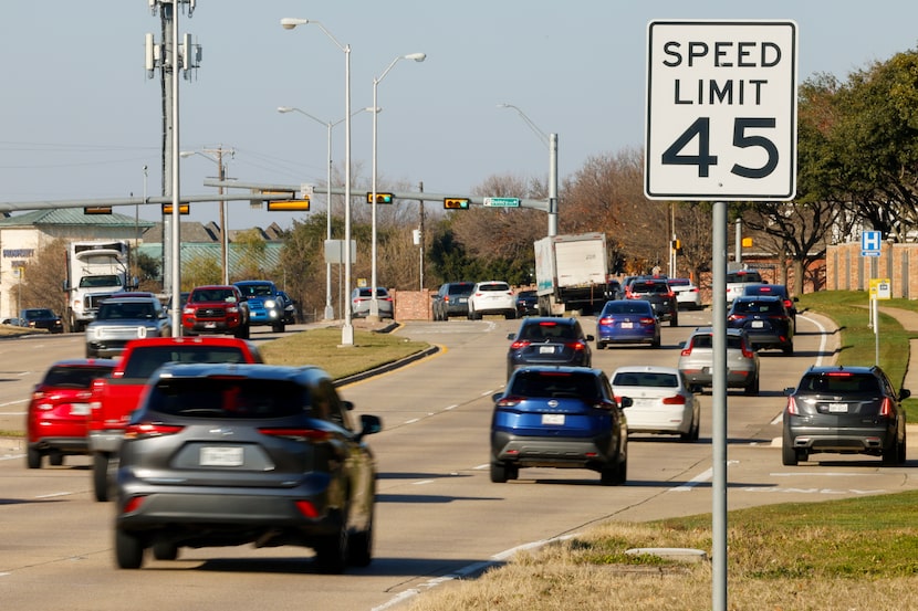 Cars drive along Preston Road in Plano. TD Economics says average U.S. car prices could rise...