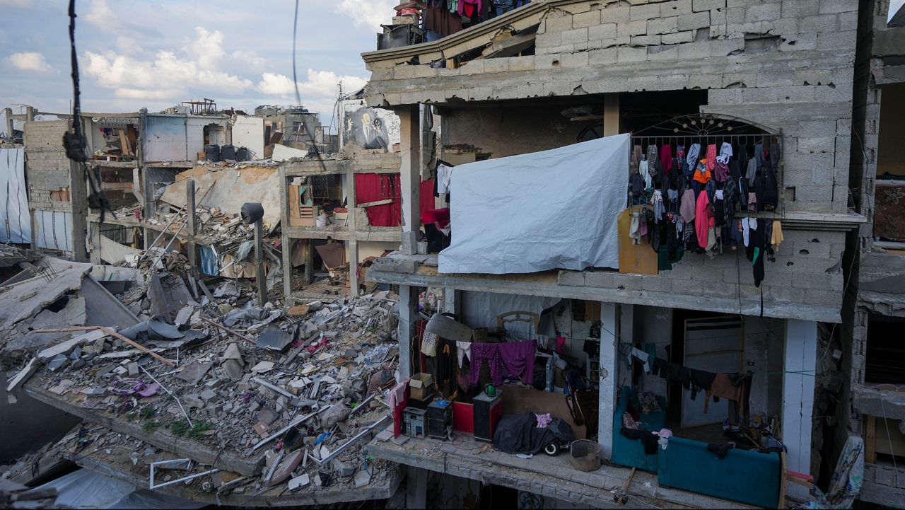 Laundry hangs on a destroyed building caused by the Israeli air and ground offensive in Jabaliya, Gaza Strip, Wednesday, Feb. 5, 2025. (AP Photo/Abdel Kareem Hana)