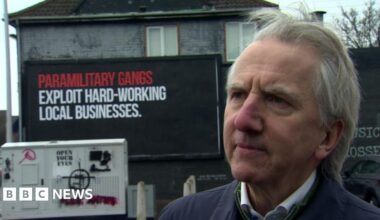 Paramilitary signs 'stigmatise' west Belfast - former Lord Mayor