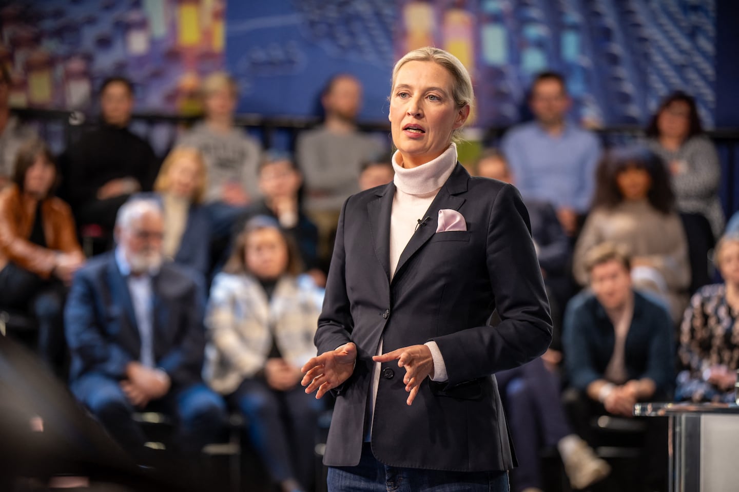 Co-leader of the far-right Alternative for Germany party Alice Weidel gestures as she talks with citizens during the TV Programm 'Klartext' hosted by the public broadcaster ZDF in Berlin on Feb. 13, 2025.