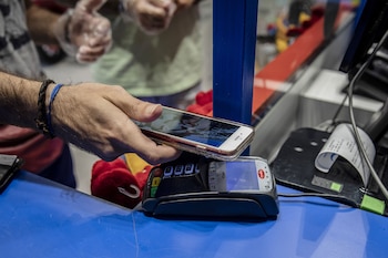 A customers makes a contactless