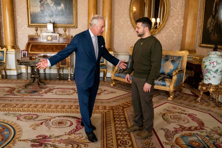 King Charles III (L) welcomes Ukraine's President Volodymyr Zelensky (R) at Buckingham Palace, in London, ahead of an audience during his first visit to the UK since the Russian invasion of Ukraine. - Ukraine's President Volodymyr Zelensky on Wednesday hailed Britain as "one of the first" countries to support Ukraine after Russia invaded, on his first visit to London since the war broke out nearly a year ago. (Photo by Aaron Chown / POOL / AFP) (Photo by AARON CHOWN/POOL/AFP via Getty Images)