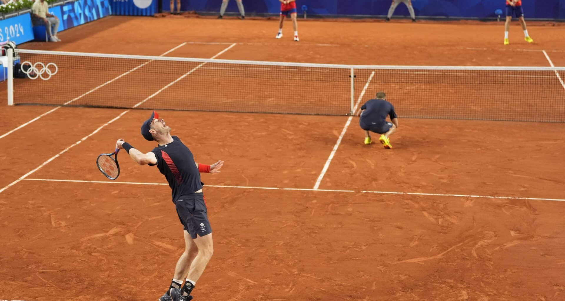 Andy Murray and Dan Evans in action for Great Britain.