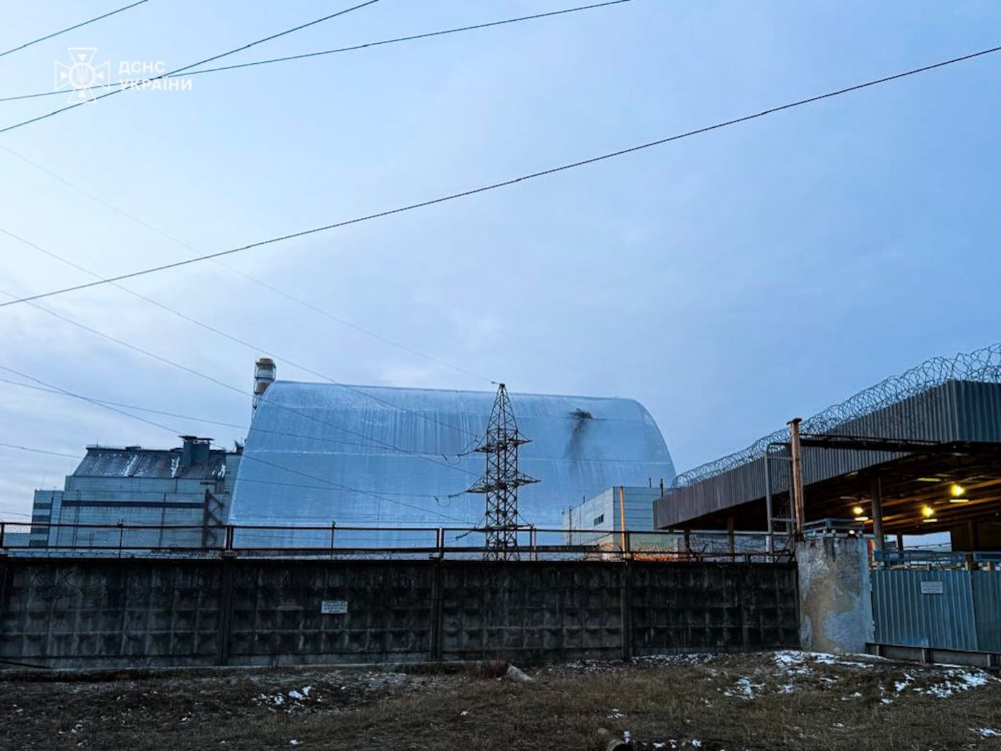 In an image released by Ukrainian authorities, the large confinement shelter over there remnants of Chernoybl's No. 4 nuclear reactor on Friday, showing damage from what Ukrainian authorities said was a Russian attack drone.