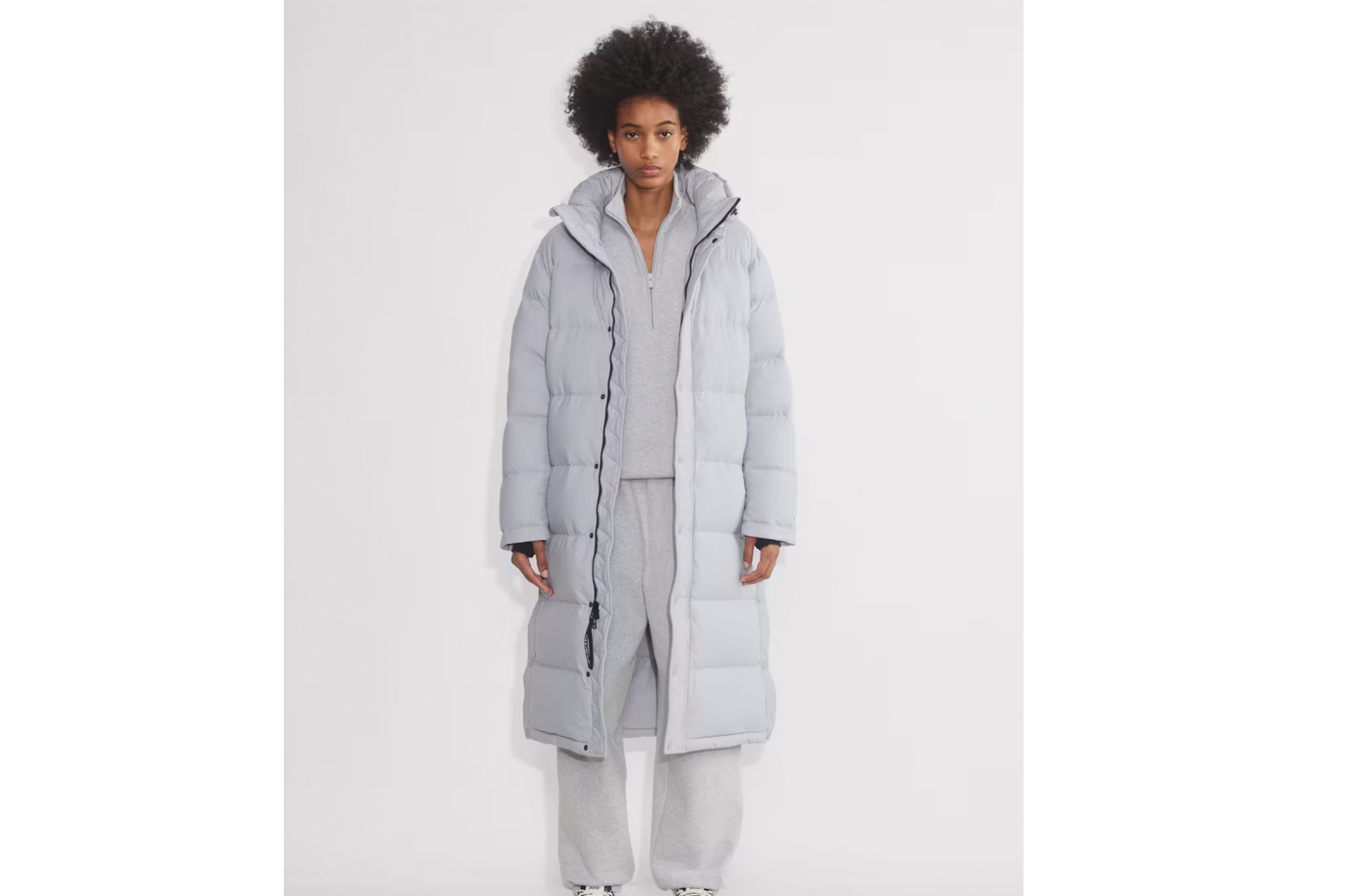 A model in a gray coat