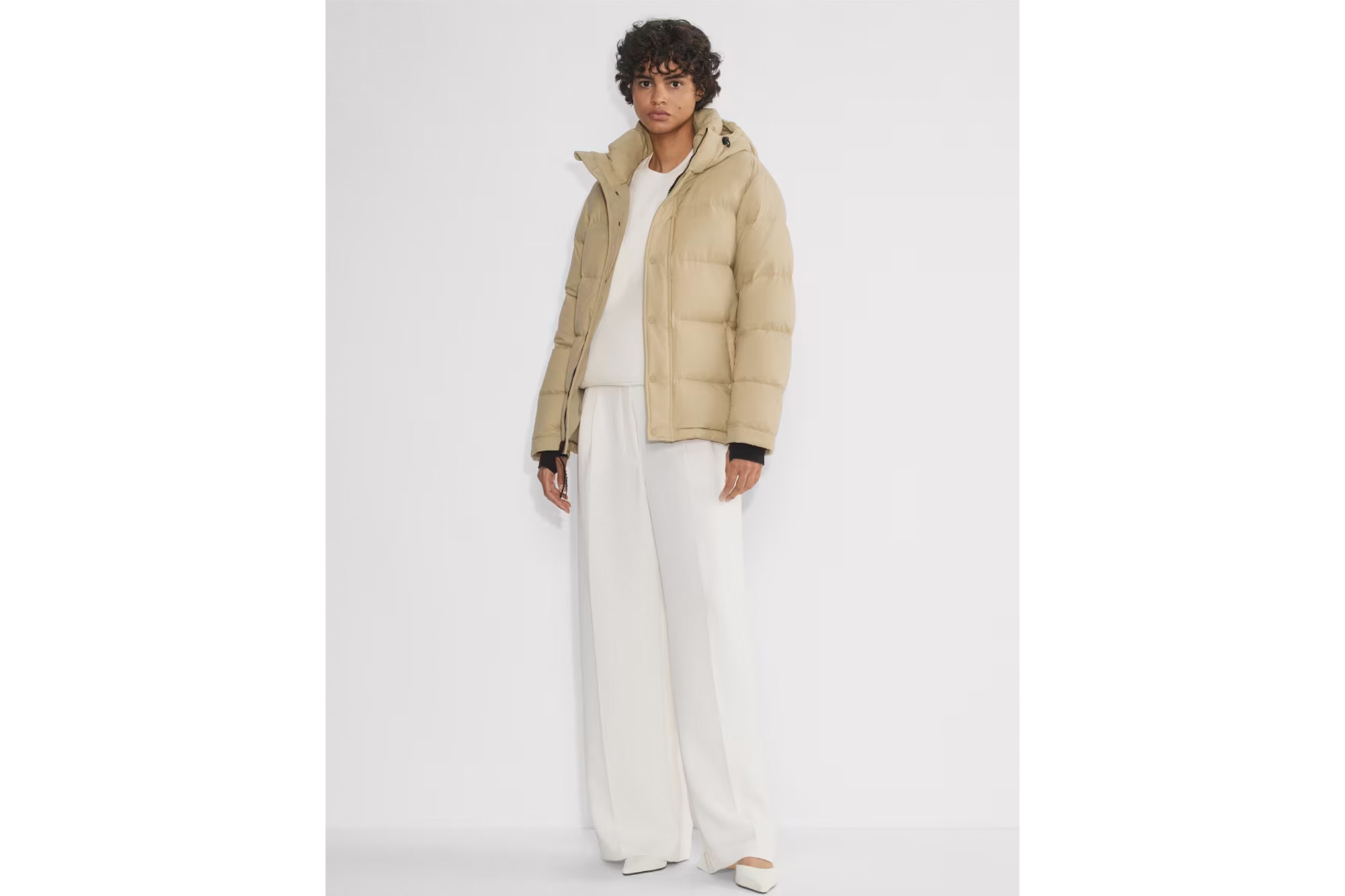 A model in a camel-colored coat