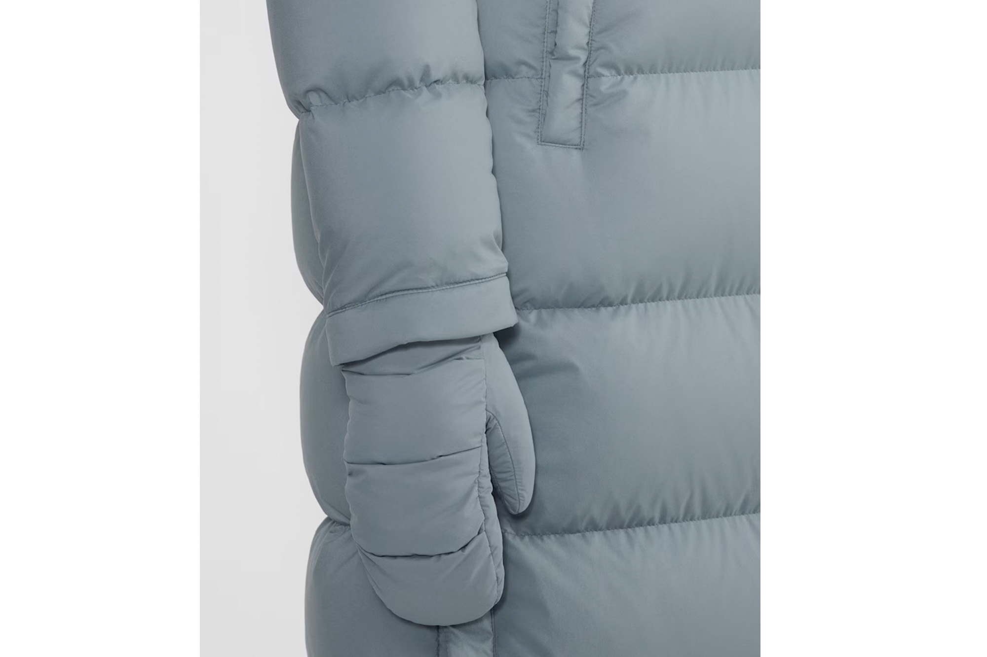 A model in a blue mitten