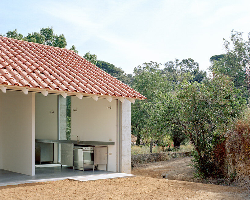 arquitectura-G combines concrete garage with residence beneath tiled roof in portugal