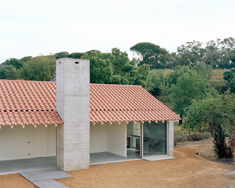 arquitectura-G combines concrete garage with residence beneath tiled roof in portugal