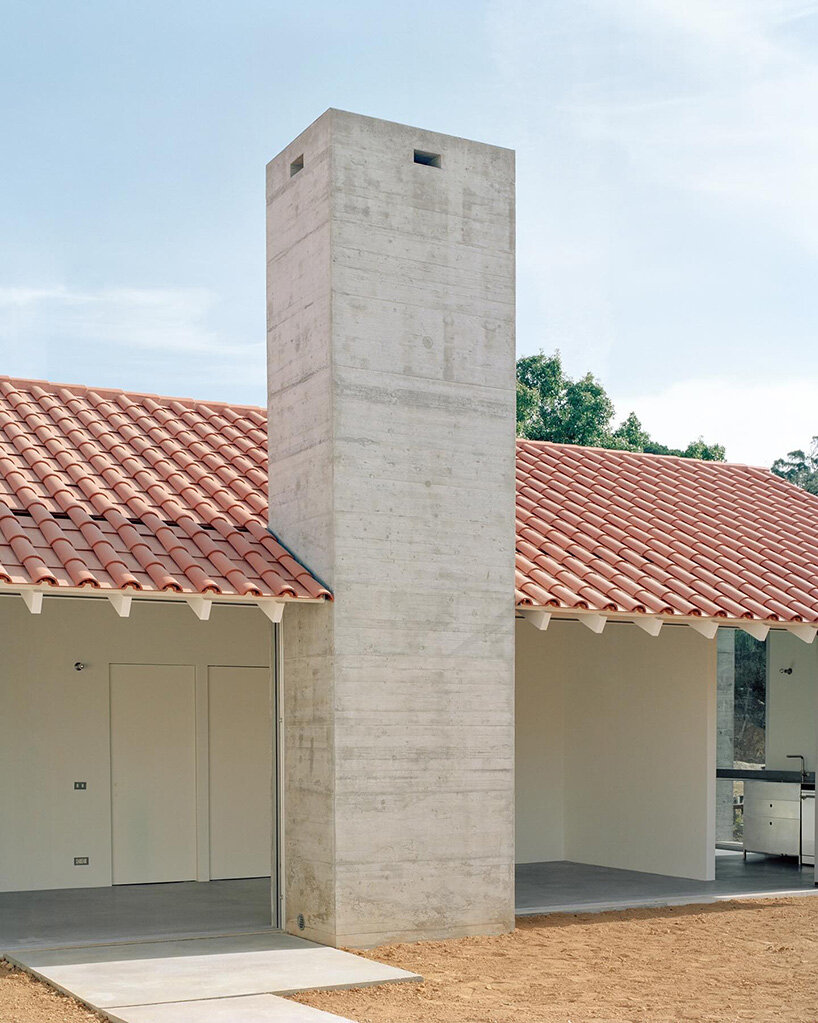 arquitectura-G combines concrete garage with residence beneath tiled roof in portugal