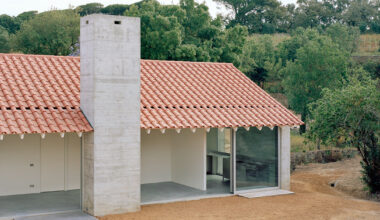 arquitectura-G combines concrete garage with residence beneath tiled roof in portugal