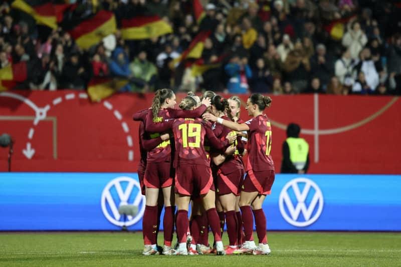 Germany's players celebrate their side's third goal of the game during the UEFA Women's Nations League soccer match between Germany and Austria at the Max-Morlock Stadium Daniel Löb/dpa