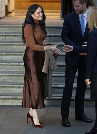 Meghan Markle wearing a brown outfit
