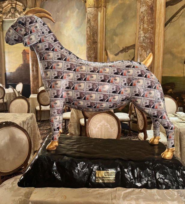 At Mar-a-Lago, a bizarre, golden-hoofed goat idol is on display, signed "I love you" by Trump.