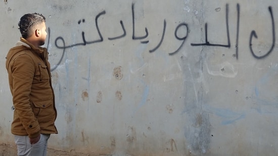 At the age of 14, Mouawiya Syasneh spray-painted a wall with phrases that would have serious repercussions.