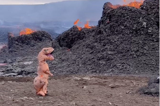 Person Brought Dino Suit to Iceland for This Moment