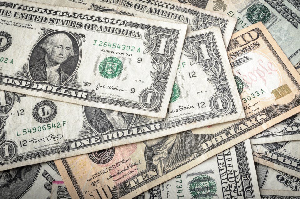 Pile of assorted US dollar bills.