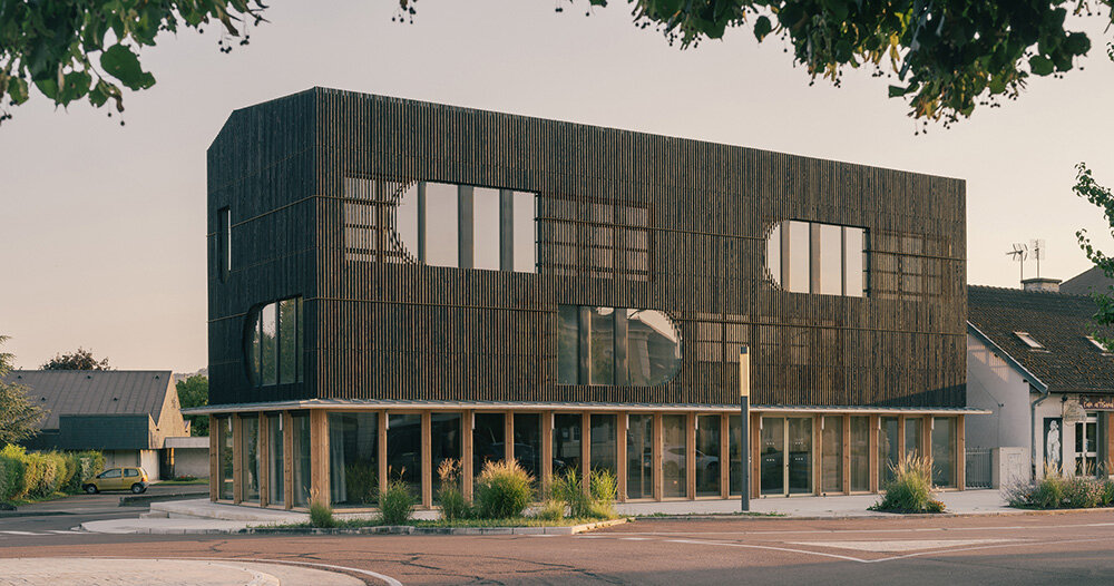 dark shousugiban wood facade wraps creative hub in rural france
