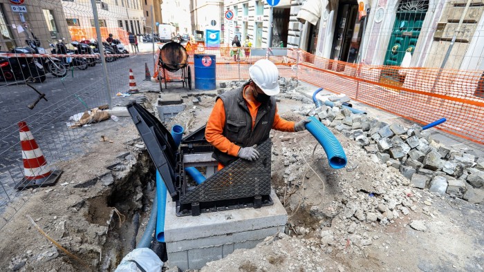 Fibre optic cables being fitted by FiberCop workers in downtown Rome
