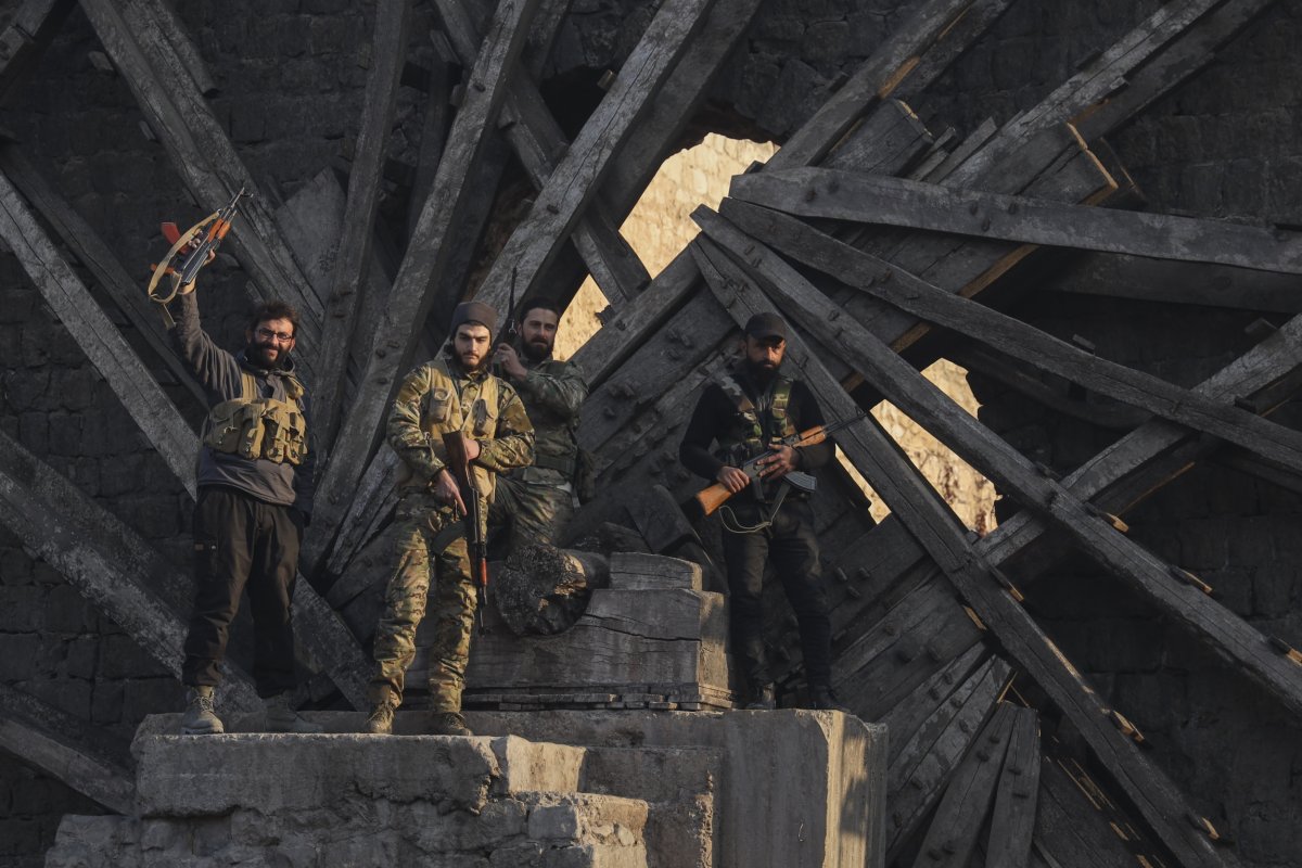 Insurgent fighters celebrate takeover of Hama