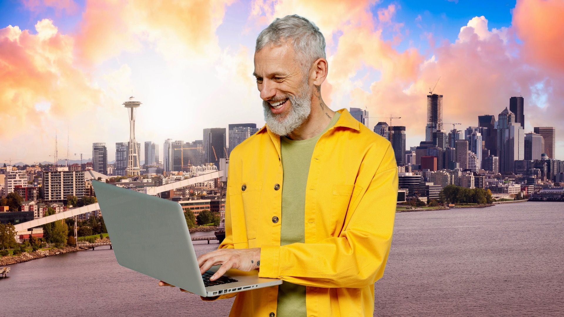 A remote worker stands in front of Seattle, WA, skyline