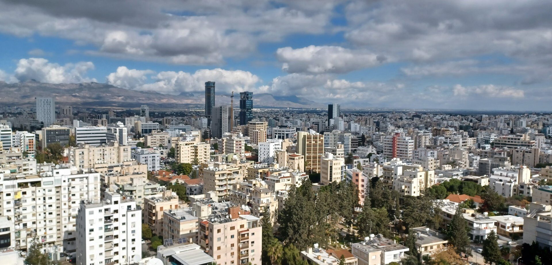 cover Cyprus Business Now: airport expansion, property sales, inflation, unemployment