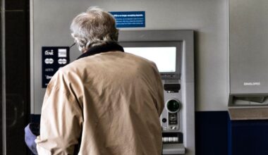 A customer makes a transaction at an automatic teller machine in Los Angeles on March 27, 2023. (AP Photo/Richard Vogel, File)