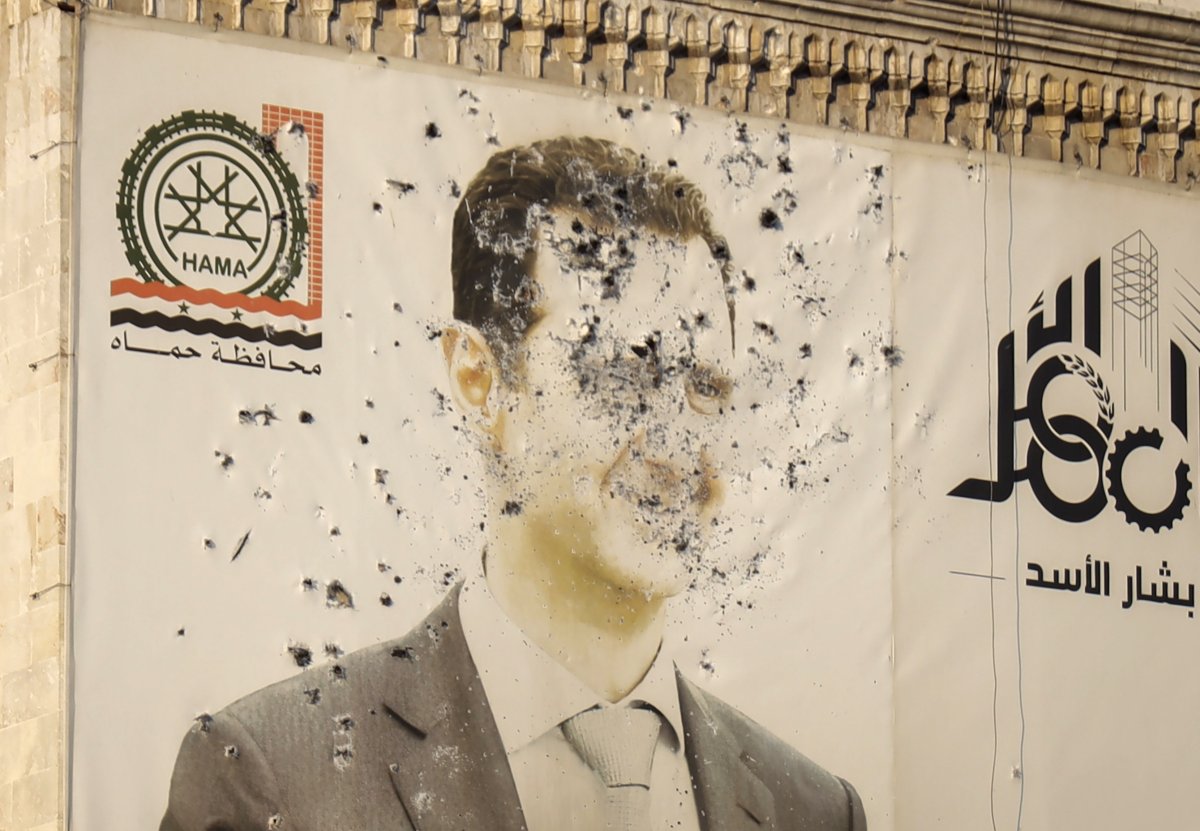 Poster of Assad riddled with bullets