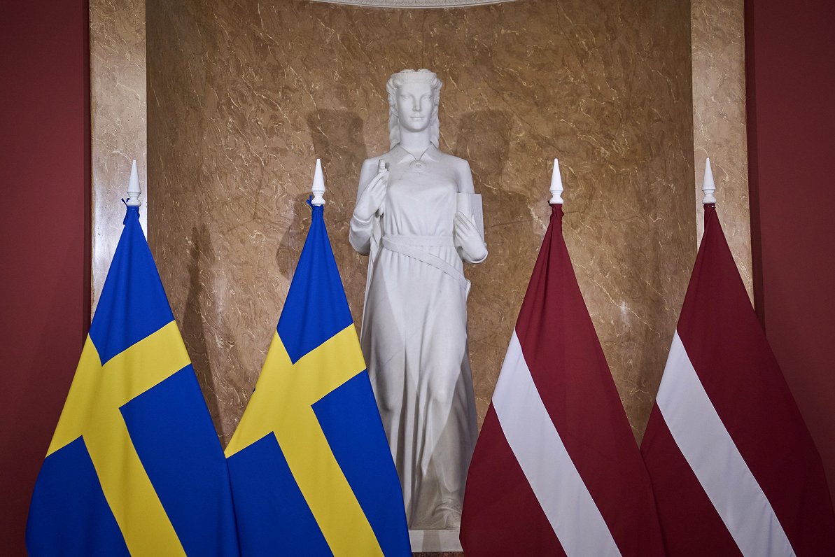 Flags of Sweden and Latvia in cabinet building