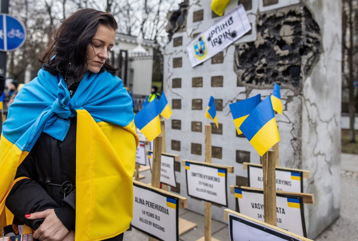 Woman in Ukrainian flag Warsaw