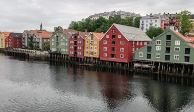 Houses on the banks of Nidelva River, Trondheim, Norway .