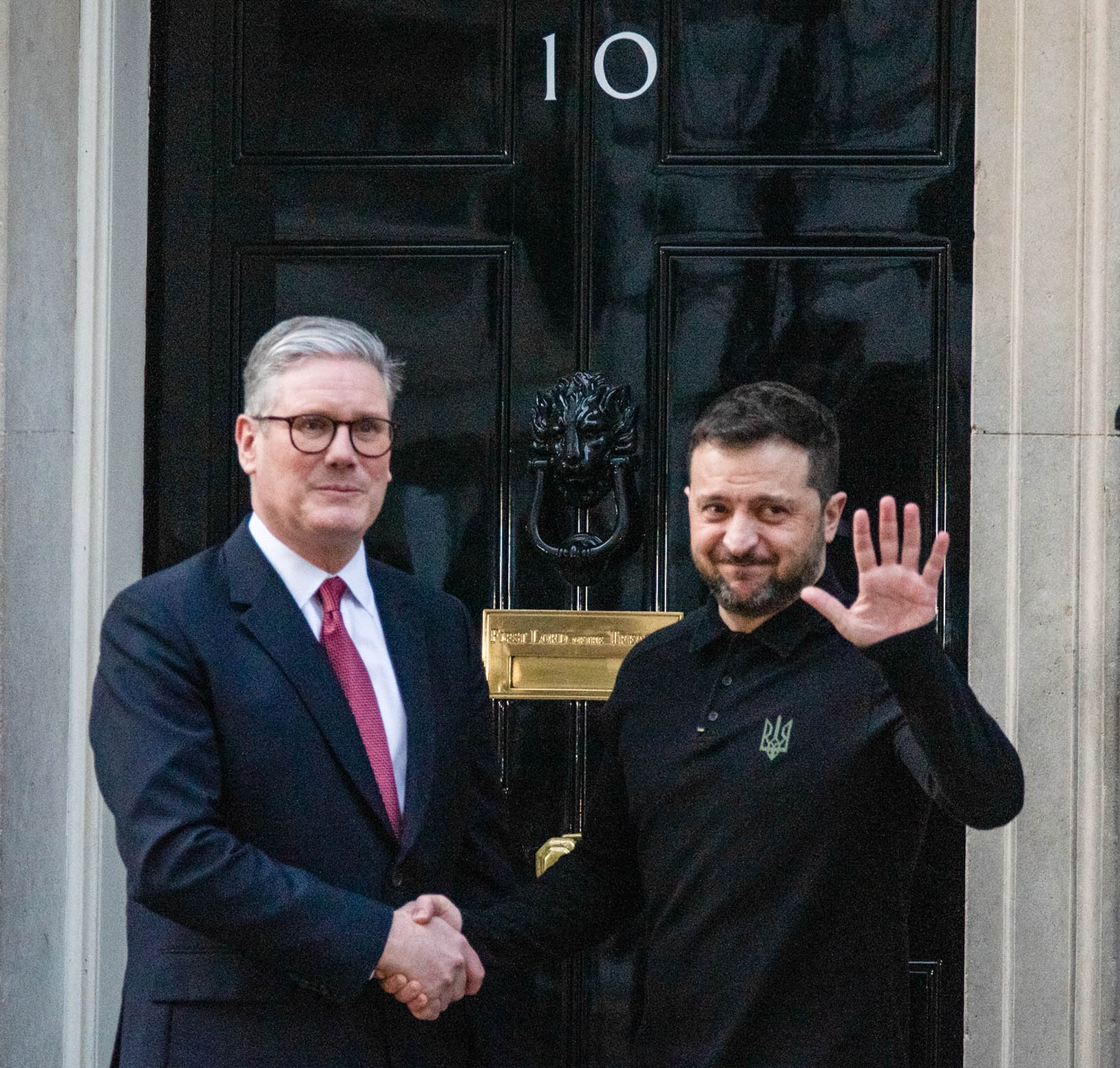Volodymyr Zelenskyy and Keir Starmer shaking hands outside 10 Downing Street.