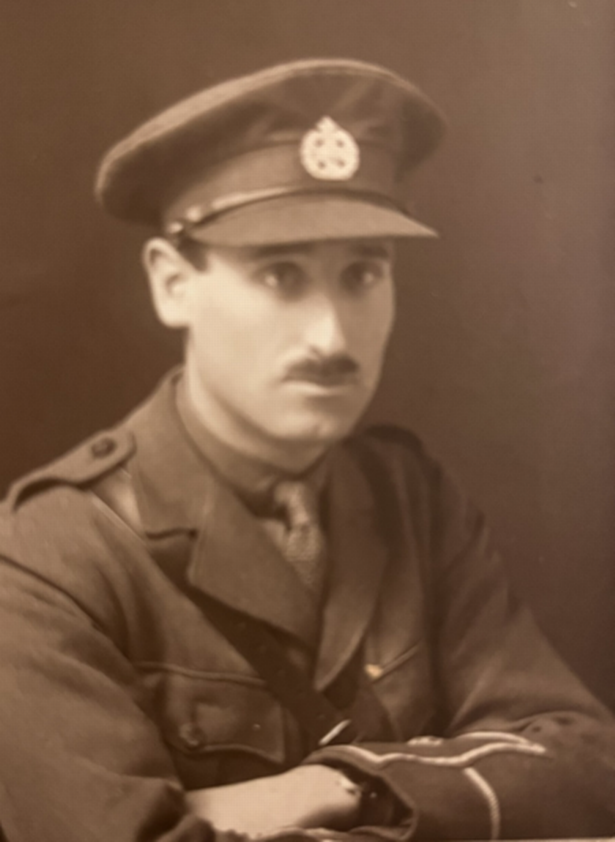 Old black-and-white photograph of a Hugh Barr dressed in his officer's uniform