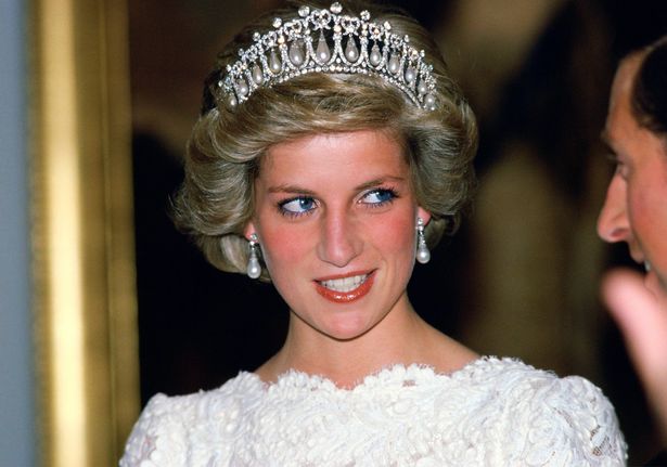 WASHINGTON, UNITED STATES - NOVEMBER 11:  Diana, Princess Of Wales, Talking To Her Husband, During A Visit To The British Embassy.  The Princess Is Wearing A Taffeta And Lace Gown With A Scalloped Neckline Designed By Murray Arbeid With Queen Mary's Diamond And Pearl Tiara, A Present From The Queen.  (Photo by Tim Graham Photo Library via Getty Images)