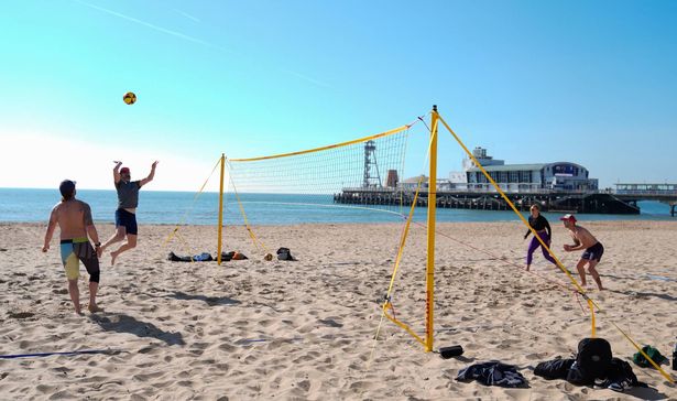 People play volleyball on Bournemouth Beach